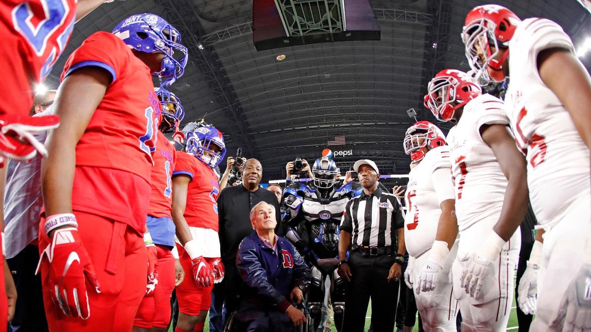 Texas Governor Greg Abbott performs the coin toss for the State 6A Division I Championship football game at AT&T Stadium, Arlington, Texas, Saturday, Dec. 22, 2018. North Shore led 29-20 at the half. (Star-Telegram Bob Booth)