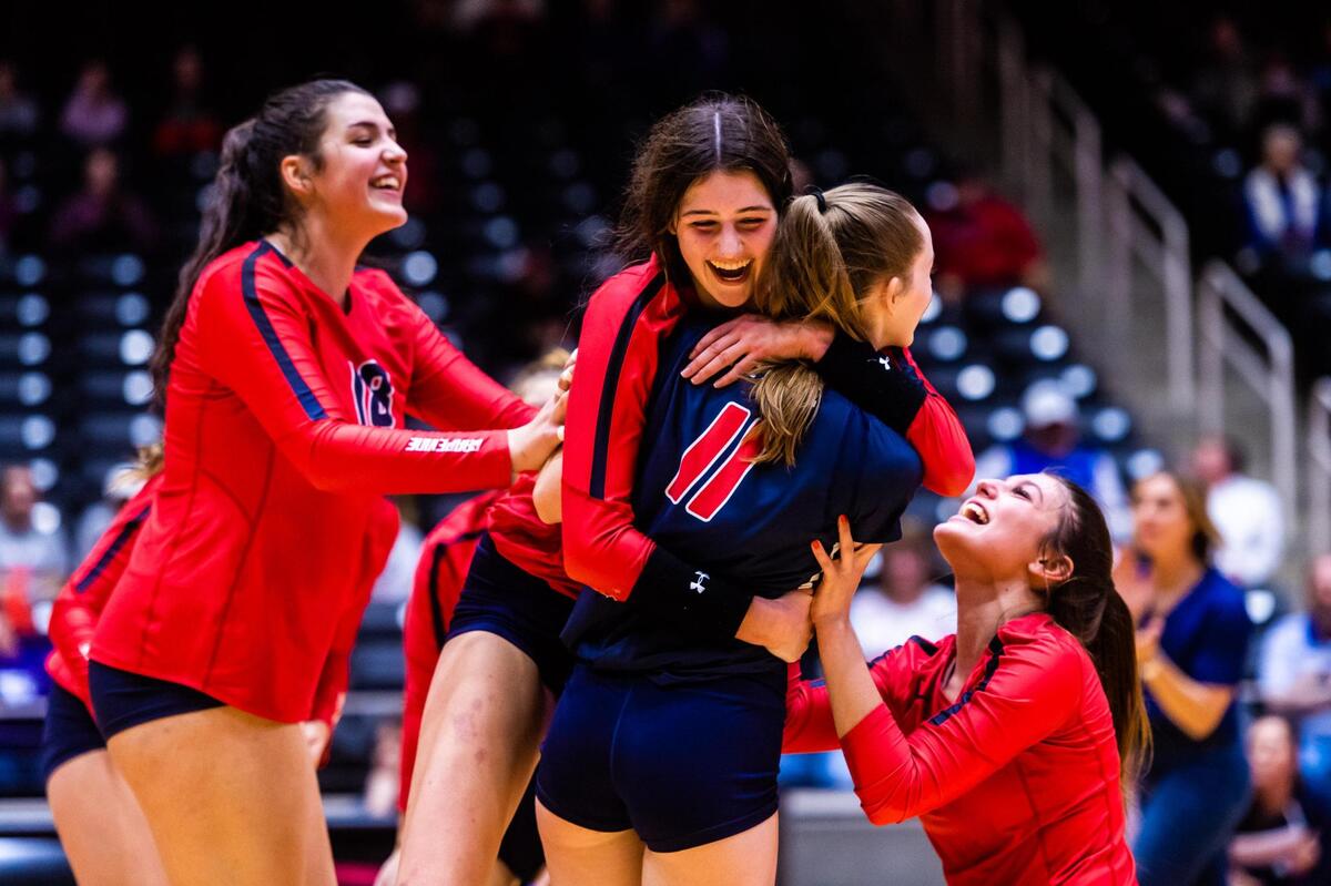 Janet DeMarrais hugs Helen Hood (11) in celebration during the 5A state semifinal game between Grapevine and Comal Canyon at the Curtis Culwell Center in Garland on November 19, 2021. Photo by Matt Smith. Special to the Star-Telegram.
