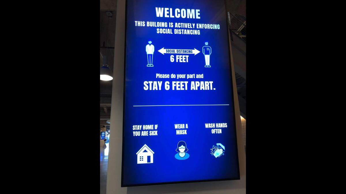 Health and safety recommendations were shown inside AT&T Stadium during the 2020 high school graduations.