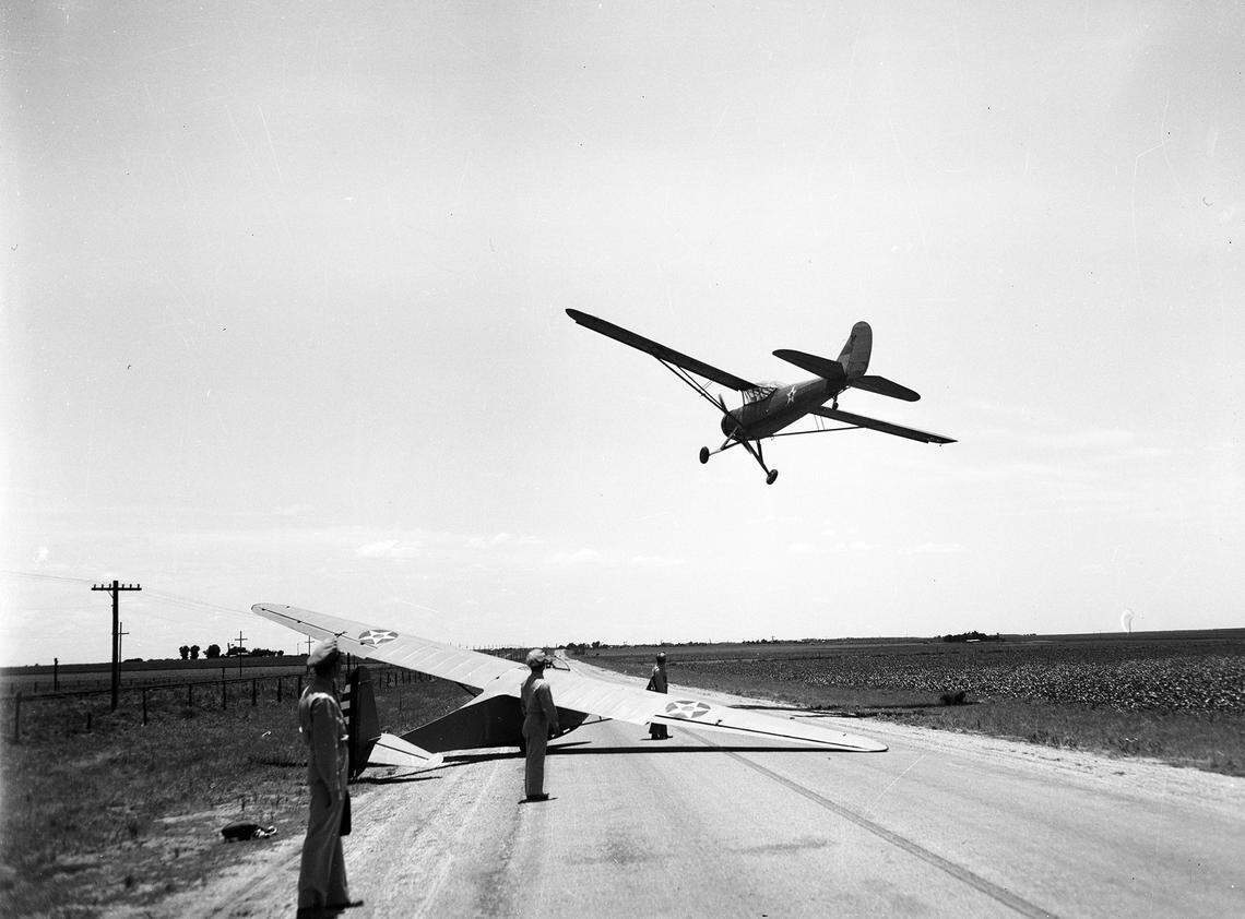 July 7, 1942: A tow plane that had launched the military glider makes a landing on a rural highway in West Texas as part of Lamesa Advanced Air Force Glider School, where the military trained glider pilots for World War II.