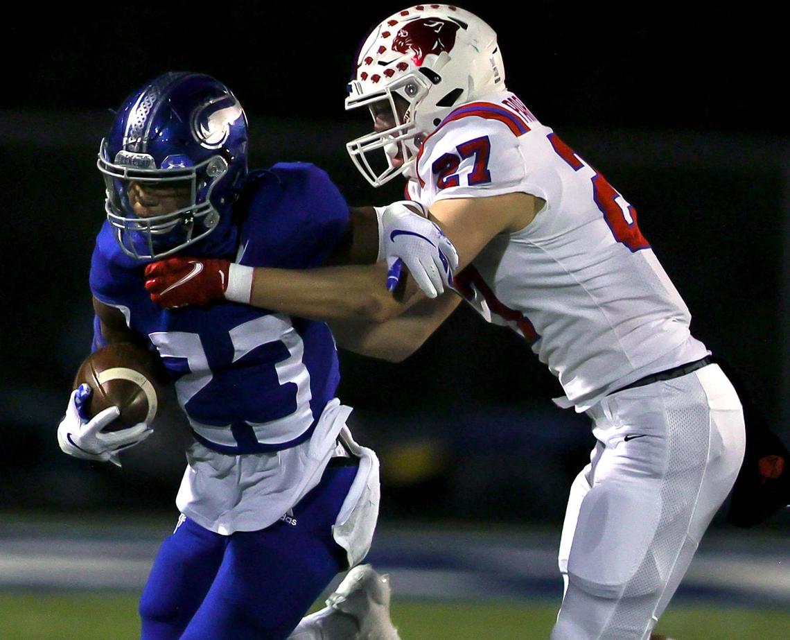 Nolan running back Sergio Snider (23) tries to fight off a tackle from Parish Episcopal defensive back Henry Partridge (27) during the first half of a high school football game, November 13, 2020 played at Doskocil Stadium in Fort Worth, Tx. (Steve Nurenberg Special to the Star-Telegram)