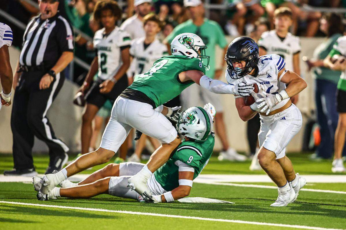 Trophy Club Byron Nelson’s Tucker James (26), right, carries the ball against Southlake Carroll in a District 4-6A game on Friday, September 13, 2024 at Dragon Stadium in Southlake, Texas.