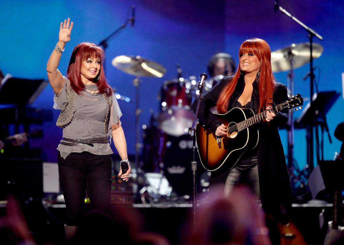 In this April 4, 2011 file photo, The Judds, Naomi Judd, left, and Wynonna Judd performed at the Girls’ Night Out: Superstar Women of Country in Las Vegas. The Grammy-winning duo was inducted into the Country Music Hall of Fame the day after Naomi Judd died “from the disease of mental illness.”