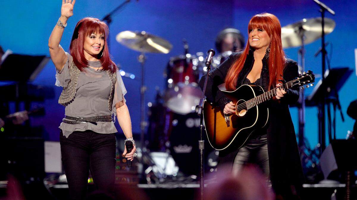 FILE - In this April 4, 2011 file photo, The Judds, Naomi Judd, left, and Wynonna Judd perform at the Girls’ Night Out: Superstar Women of Country in Las Vegas. (AP Photo/Julie Jacobson, File)
