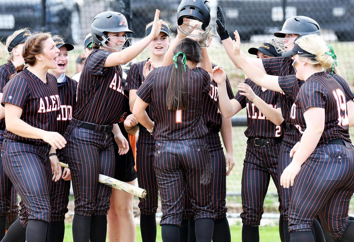 Aledo’s Macy Graf, center celebrates with teammates after hitting a lead off home run to start the first inning of their Class 5-5A softball game against Azle, Tuesday March 16, 2021 at Azle High School in Azle, Texas. Aledo went on to win 4-0. Special/Bob Haynes