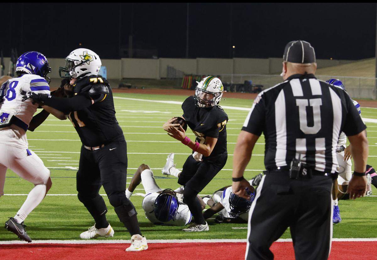 Benbrook quarterback Brennan Barton (17) scores the game-winning touchdown during the second half of a UIL football game between Benbrook and Dunbar at Herman E. Clark Stadium in Fort Worth, Texas, Friday, October 10, 2025.