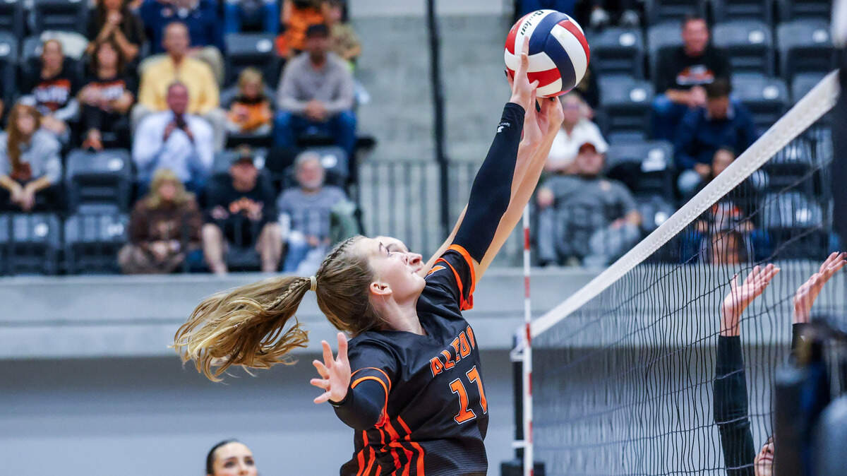 Aledo’s Brynlee Schneider (17) and a teammate block a shot at the net in Thursday’s bidistrict playoff game between Aledo and Colleyville Heritage at Arlington ISD Athletics Center, Thursday, Oct. 30, 2025.