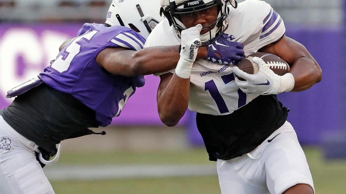 TCU safety Jamel Johnson (25) reaches in to contain running back Trent Battle (17) during the TCU Spring Game at Amon G. Carter Stadium in Fort Worth, Texas, Friday, Apr. 14, 2023. (Special to the Star-Telegram Bob Booth)