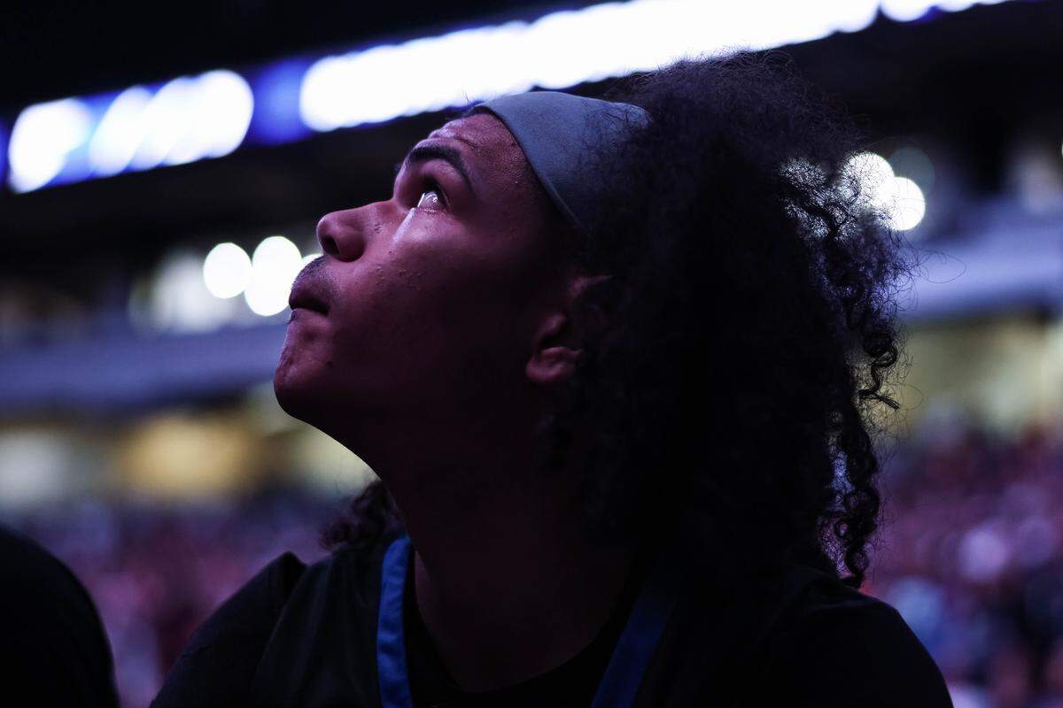 North Crowley guard Isaak Hayes (22) sits on the bench and stares up at the video board before the starting lineups are announced before the Class 6A Division I state championship against San Antonio Brennan at The Alamodome in San Antonio, Texas, March 14, 2026.