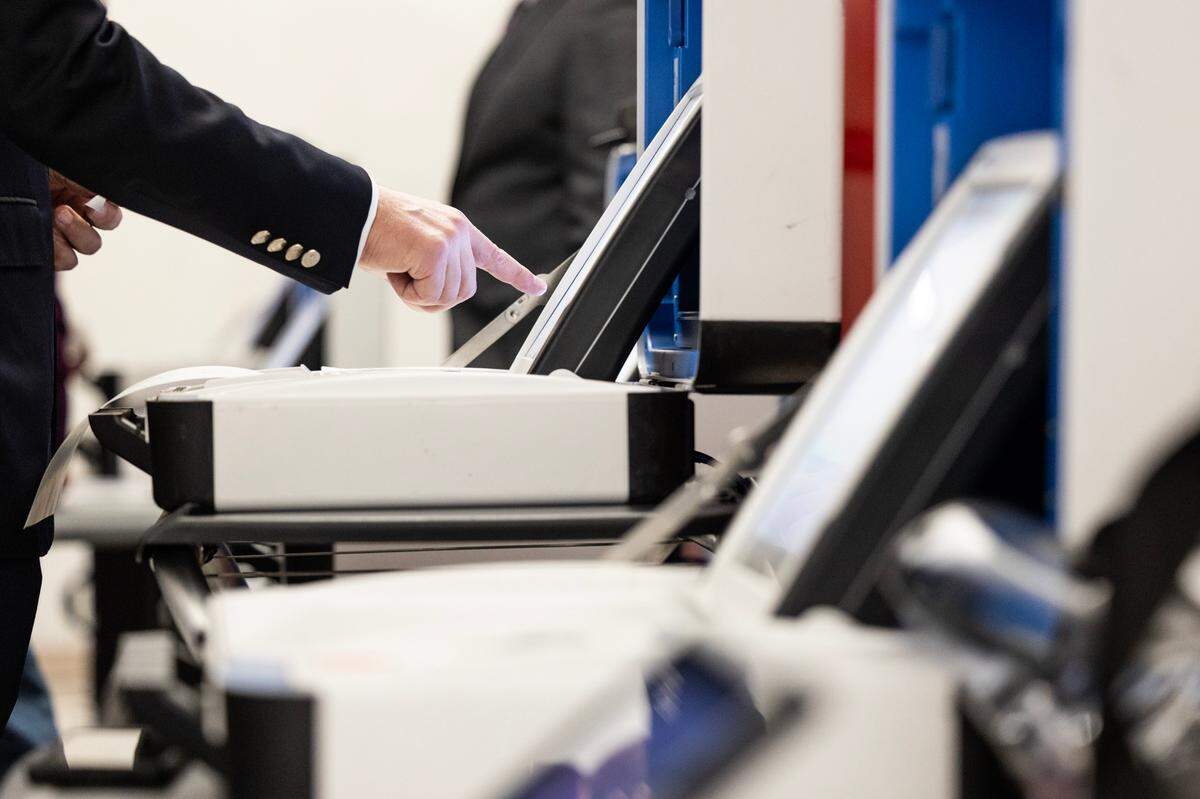 People participate in a public mock election to test the integrity of the voting equipment at the Tarrant County Election Administration building in Fort Worth on Thursday, Jan. 11, 2023.