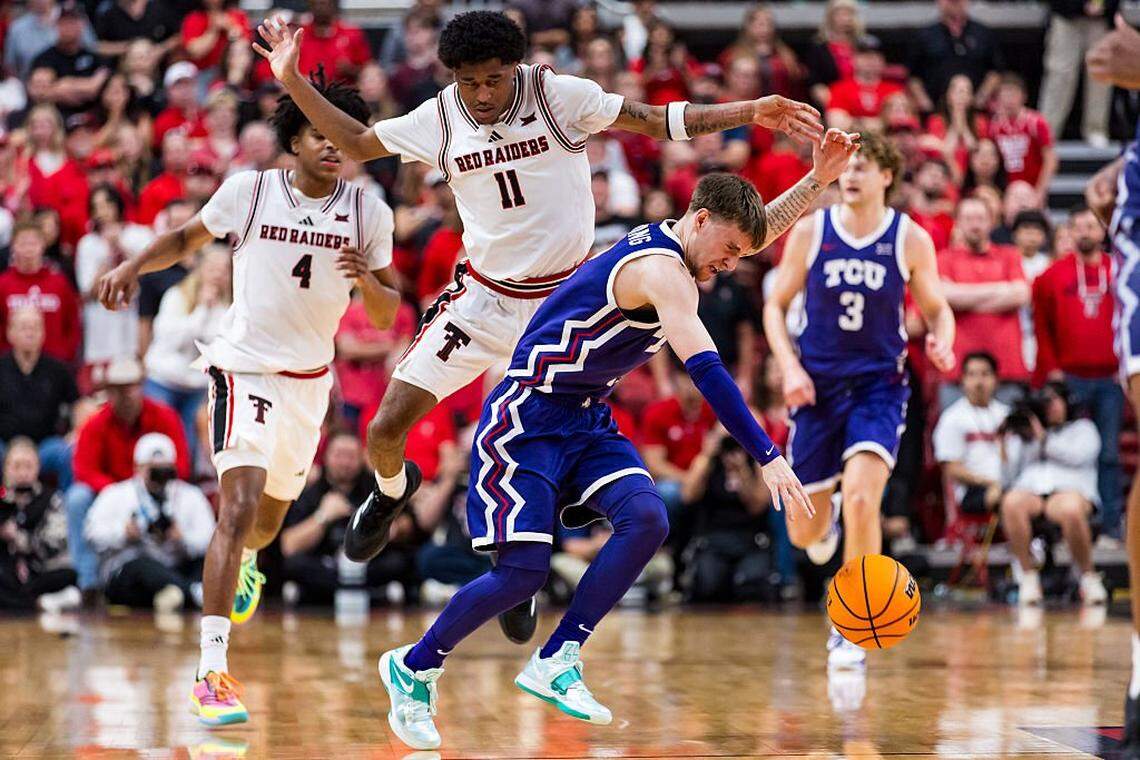 LUBBOCK, TEXAS - MARCH 03: Brock Harding #2 of the TCU Horned Frogs is fouled by Jaylen Petty #11 of the Texas Tech Red Raiders during the second half of the game at United Supermarkets Arena on March 03, 2026 in Lubbock, Texas. (Photo by John E. Moore III/Getty Images)