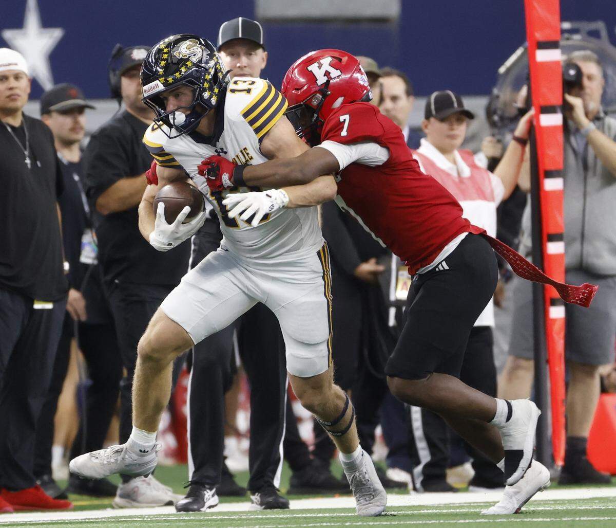 Kilgore defensive back Ja'Kalen Sheffield (7) takes Stephenville wide receiver Brighton DeVivo (13) out of bounds during the first half of the UIL Class 4A Division I championship game on Friday Dec. 19, 2025 at AT&T Stadium in Arlington, Texas.