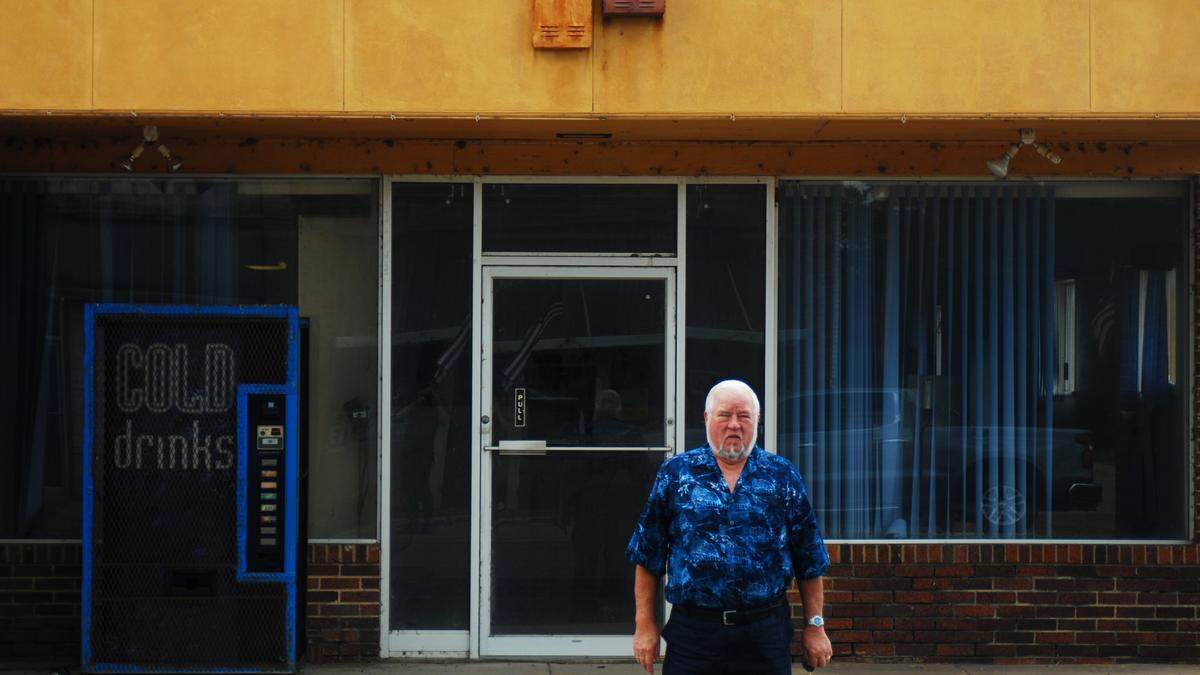 Noel Bailey, stands in front of the former site of the Enloe State Bank in Enloe, Texas, a small unincorporated settlement just north of Cooper in Delta County. Bailey served as president of the bank between 1975 and the early 1990s. The bank moved all its operations to Cooper in 2008, leaving its original location, opened in 1928, vacant.