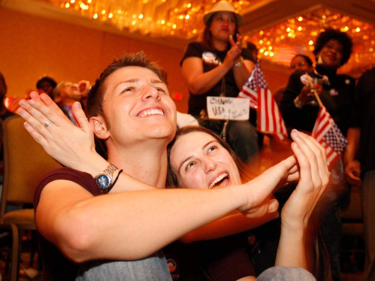 Nov. 4, 2008: Sam Blackwell and Emma Hodcroft of Fort Worth applaud and cheer as they watch the speech of President-elect Barack Obama on Tuesday night, televised at the Fort Worth Hilton.