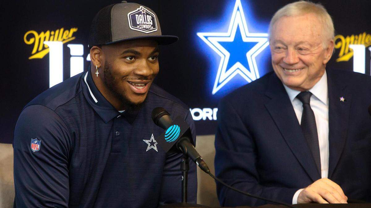 Micah Jones, left, answers questions from the media during a press conference with Jerry Jones at the Dallas Cowboys’ headquarters on Friday in Frisco.