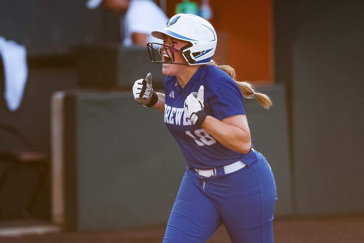 White Settlement Brewer first baseman Kamren Pride (18) screams toward her teammates in celebration after hitting a home run against Montgomery Lake Creek in the UIL Class 5A Division II state softball championship game at Red & Charline McCombs field in Austin, Texas, on Friday, May 29, 2026.