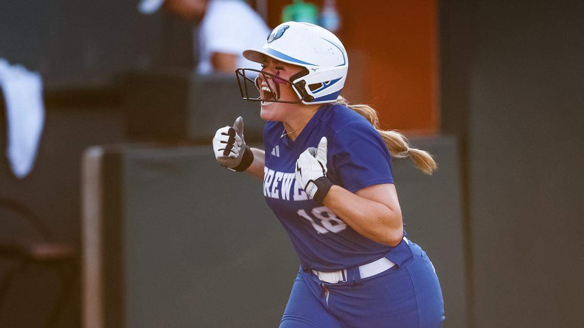White Settlement Brewer first baseman Kamren Pride (18) screams toward her teammates in celebration after hitting a home run against Montgomery Lake Creek in the UIL Class 5A Division II state softball championship game at Red & Charline McCombs field in Austin, Texas, on Friday, May 29, 2026.