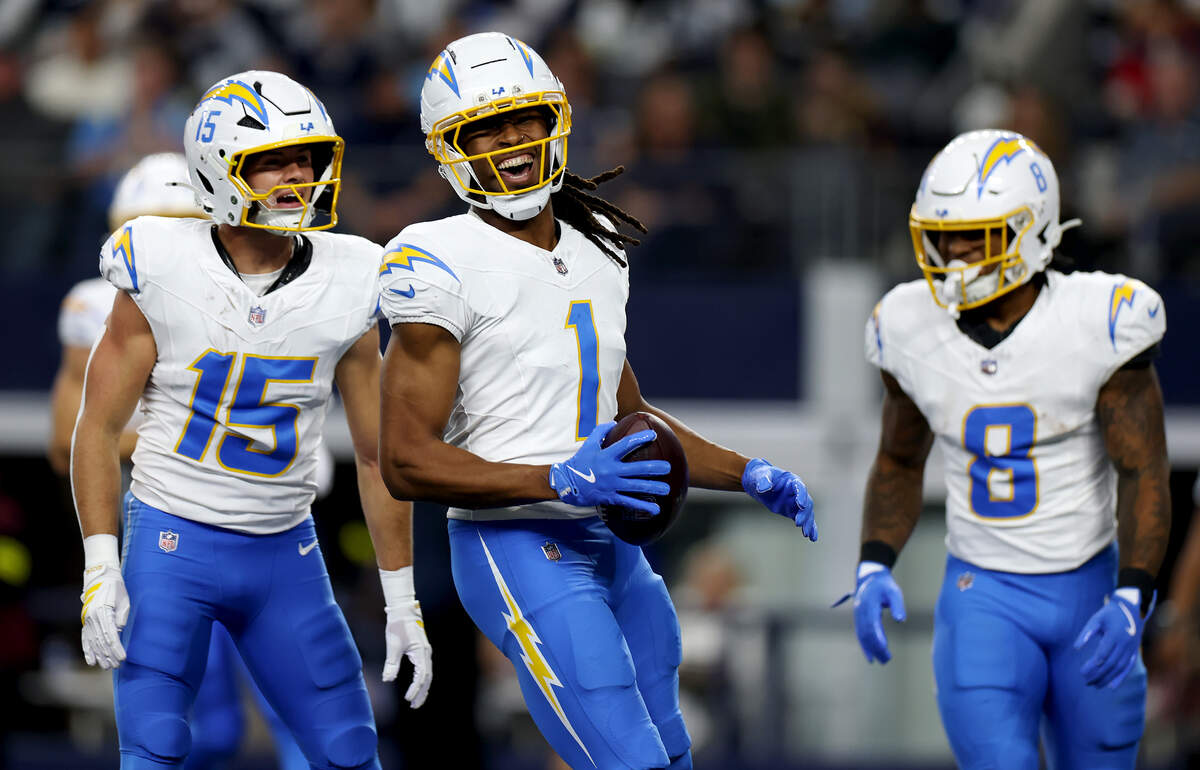 Chargers wide receiver Quentin Johnston (1) celebrates a 23-yard touchdown catch against the Cowboys in the first quarter Sunday at AT&T Stadium.