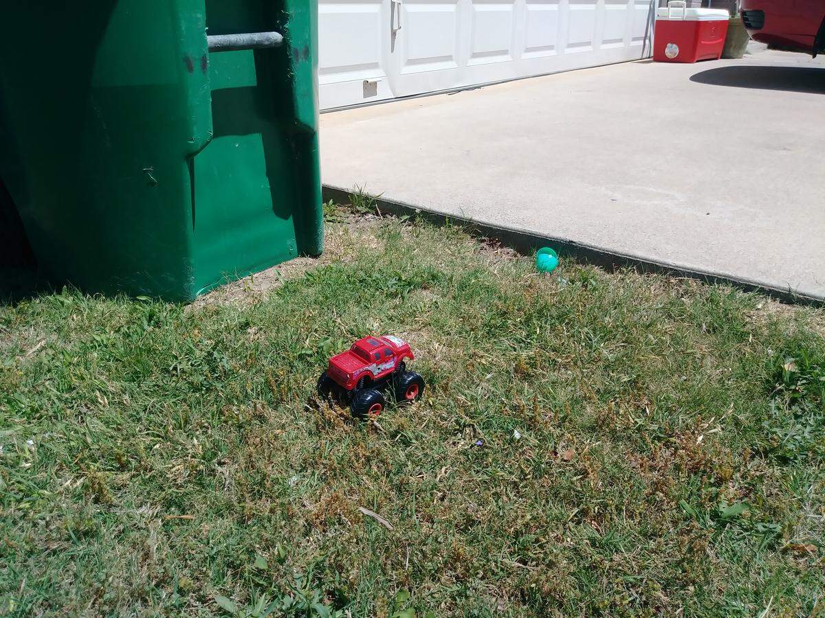 Toys left in the lawn in front of a Ponder house in which a murder-suicide that included three children happened Wednesday morning.