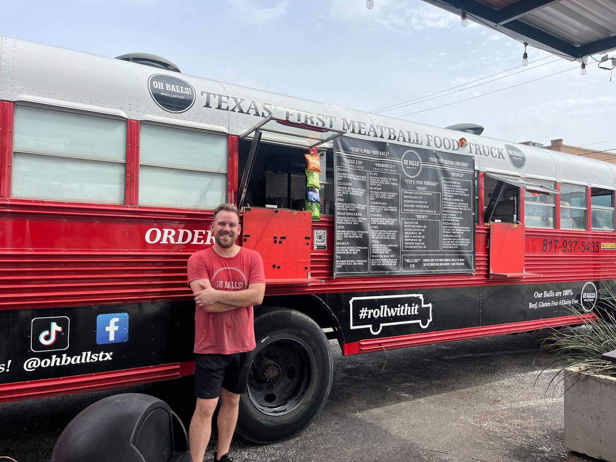 Kent Scroggins stands in front of his food truck, Oh Balls!, which is parked at 218 Bryan Ave. in Fort Worth’s South Main district.
