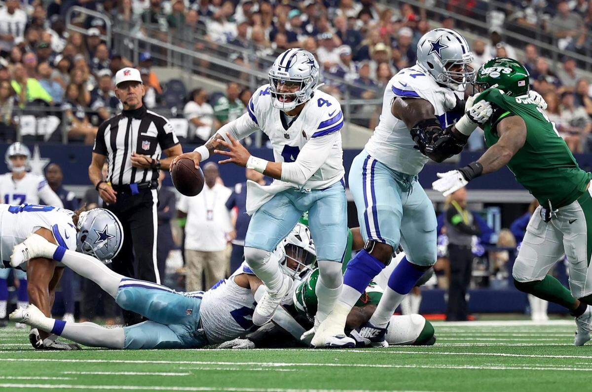 Dallas Cowboys quarterback Dak Prescott runs the ball against the New York Jets on Sunday, September 17, 2023, at AT&T Stadium in Arlington.