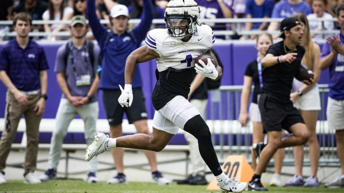 TCU running back Cam Cook (4) runs past the defense to score a touchdown in a TCU football Spring Scrimmage at Amon G. Carter Stadium in Fort Worth on Saturday,