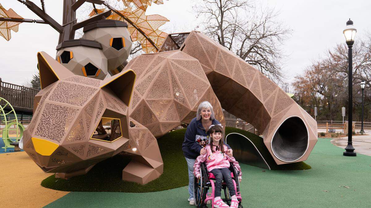 Andrea Curtis and her daughter Callie are excited about the new inclusive playground at Rose Park in Mansfield, one of the largest such playgrounds in the state.