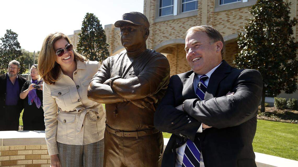TCU head football coach Gary Patterson strikes the pose on his state while posing with is wife, Kelsey Patterson, during the Parrish statue dedication outside of Ed and Rae Schollmaier Arena in Fort Worth, Texas, Saturday, April 2, 2016.