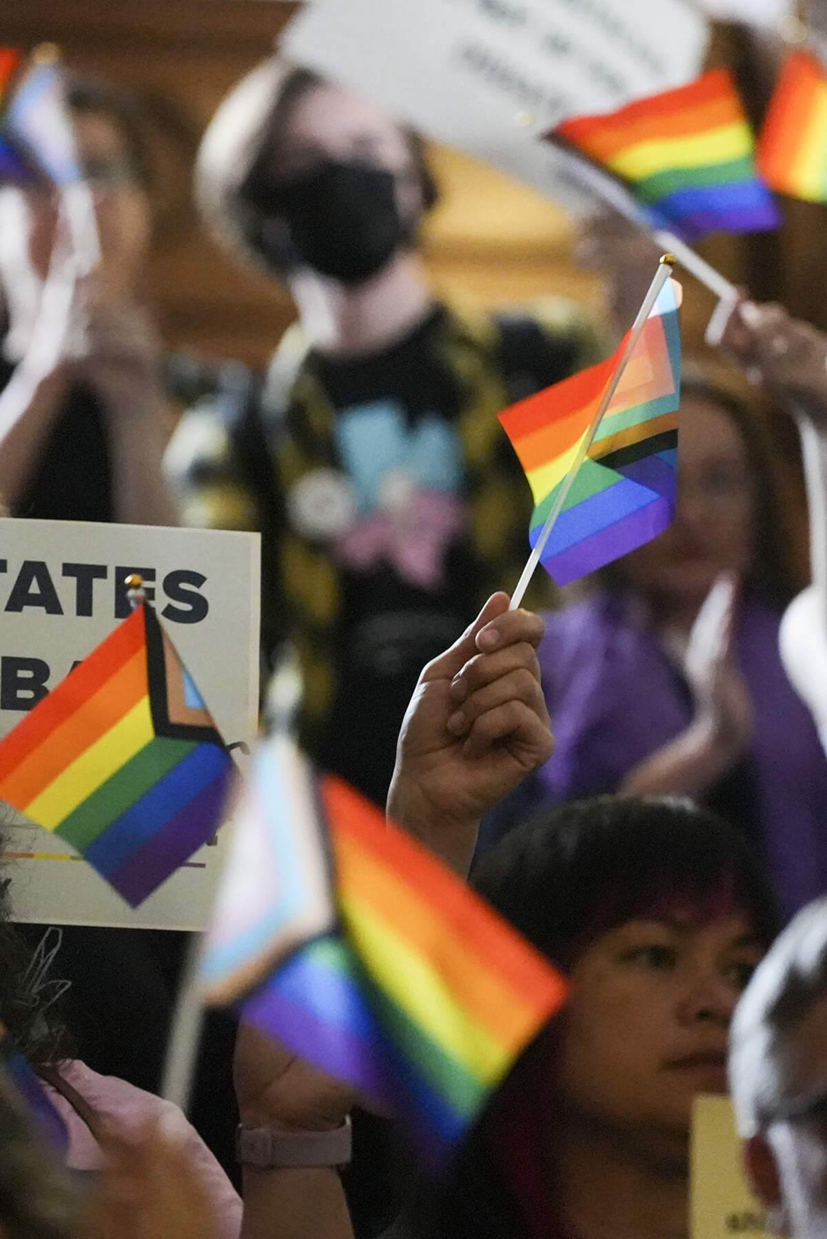 LGBTQ activists protest Senate Bill 14 at the Texas Capitol on May 12 in Austin. The bill bans gender-affirming medical care for transgender children.