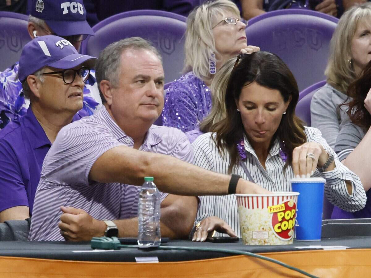 TCU head football coach Sonny Dykes enjoys a popcorn bucket as he came to support the TCU women's basketball team against Washington in a second round NCAA Division I Women's Basketball Championship game at Schollmeier Arena in Fort Worth, Texas, Sunday, March, 22, 2026.