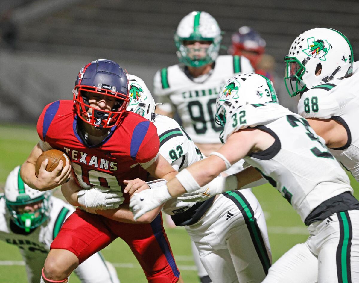 Northwest quarterback Trey Poe (10) runs into a whole bunch of Dragons during a District 4 6A football game at Northwest ISD Stadium in Justin, Texas, Thursday, Oct. 17, 2024.