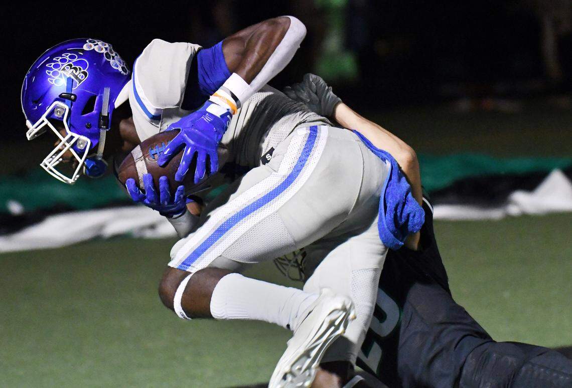 Brewer’s Will Washington, front makes the 36 yard catch over Azle’s Jack Jestis for the touchdown to take a 21-7 lead in the second quarter of their district 3-5A Division 1 football game Friday, October 22, 2021 at Hornet Stadium in Azle, Texas. Special/Bob Haynes