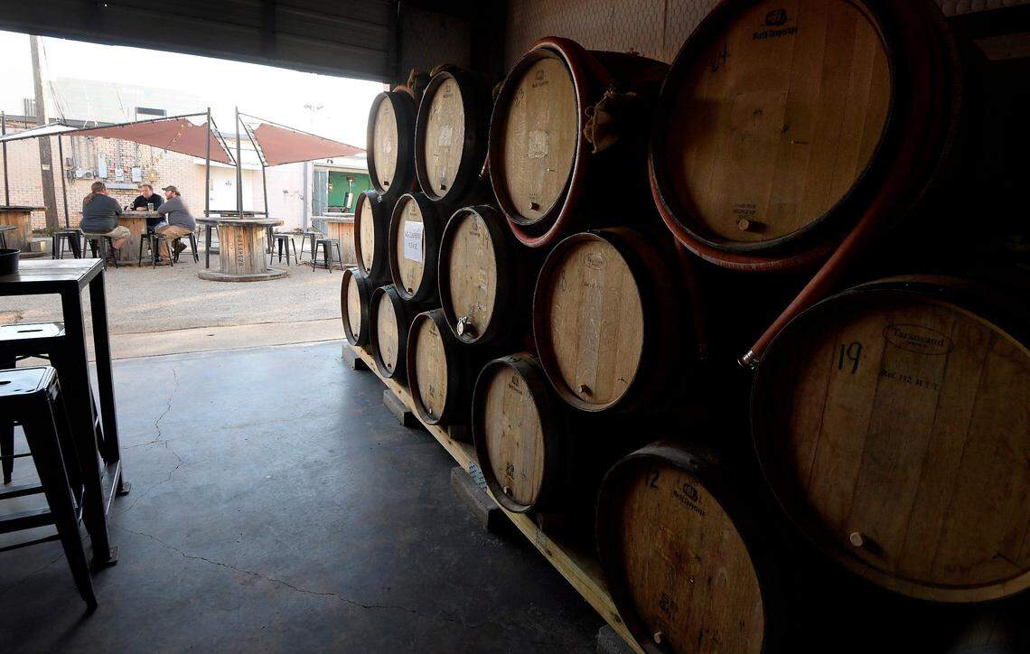 Barrels inside Division Brewing, which is one of five bars/breweries in downtown Arlington.