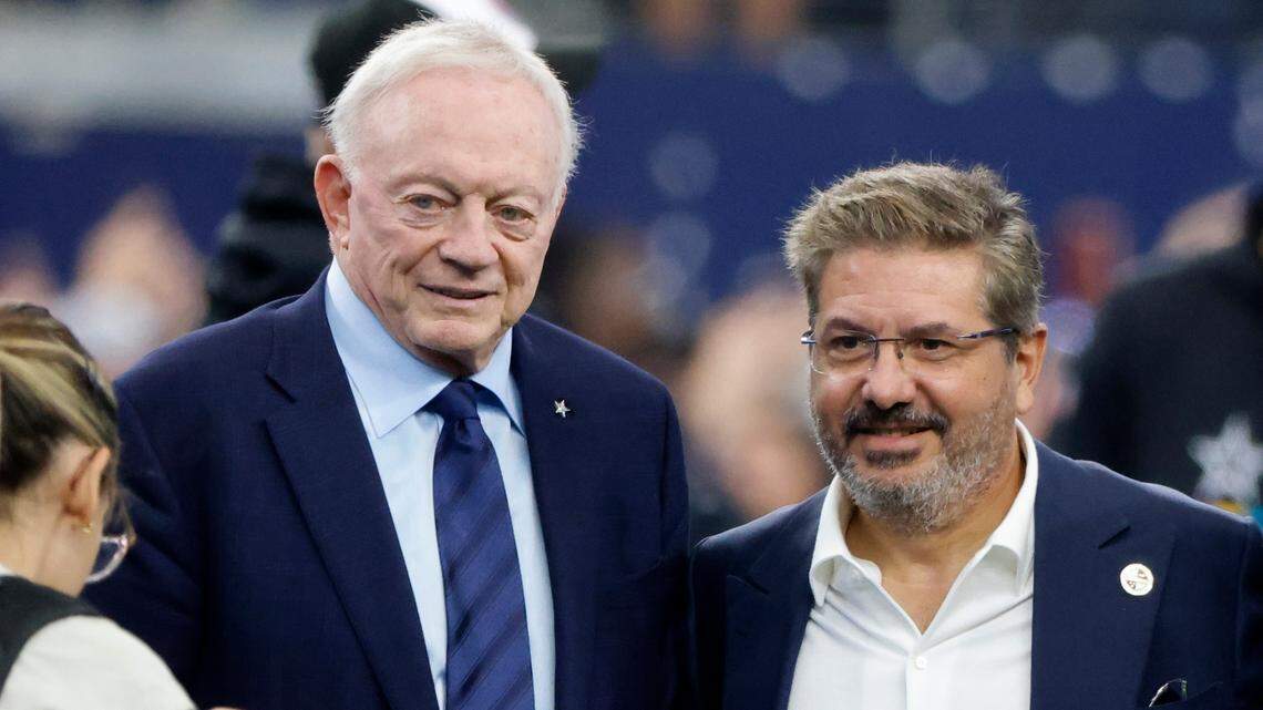 Dallas Cowboys team owner Jerry Jones and Dan Snyder, co-owner and co-CEO of the Washington Commanders, pose for a photo on the field during warmups before a NFL football game in Arlington, Texas, Sunday, Oct. 2, 2022. Jones said he hasn’t seen anything that should lead to Snyder’s ouster.