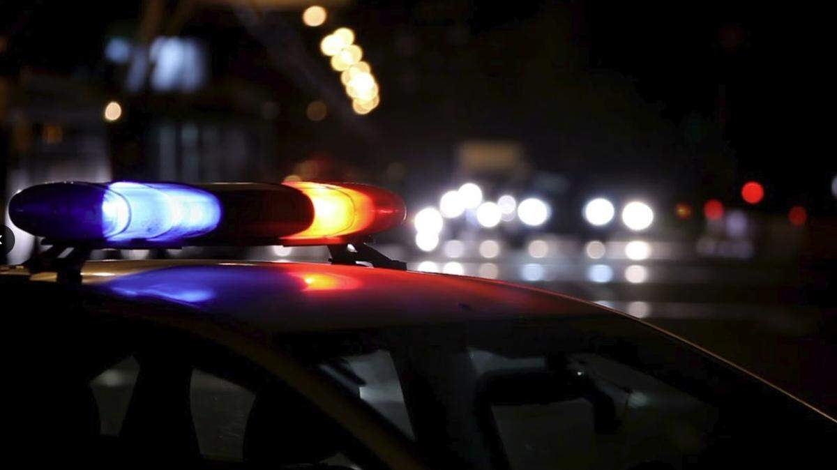 A driver racing on Sunday on an Arlington highway died when he tried to pass a car on a shoulder, lost control, went down an embankment and landed in a creek, police said.