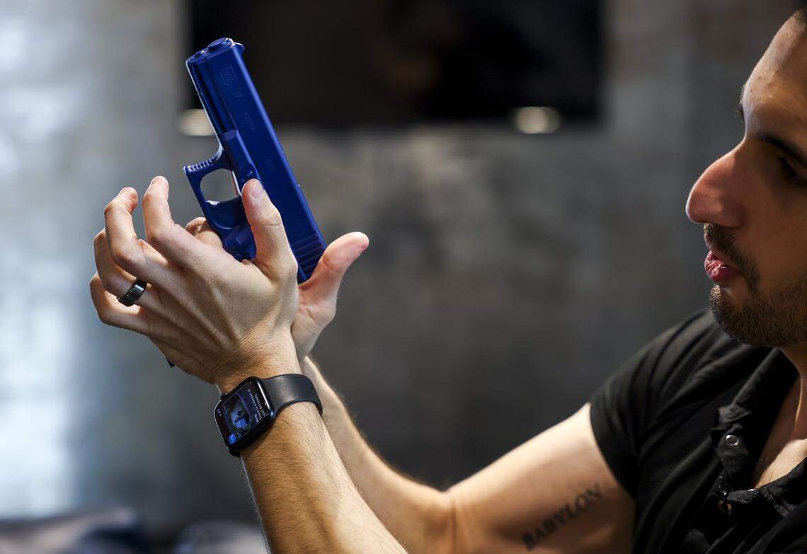 Ike Hajinazarian with Liberty for All Training Co. walks through how to hold a gun on Tuesday, April 21, 2026 in The Colony, Texas. Liberty for All Training Co. is an inclusive firearm training company that offers shooting lessons and firearm safety courses.