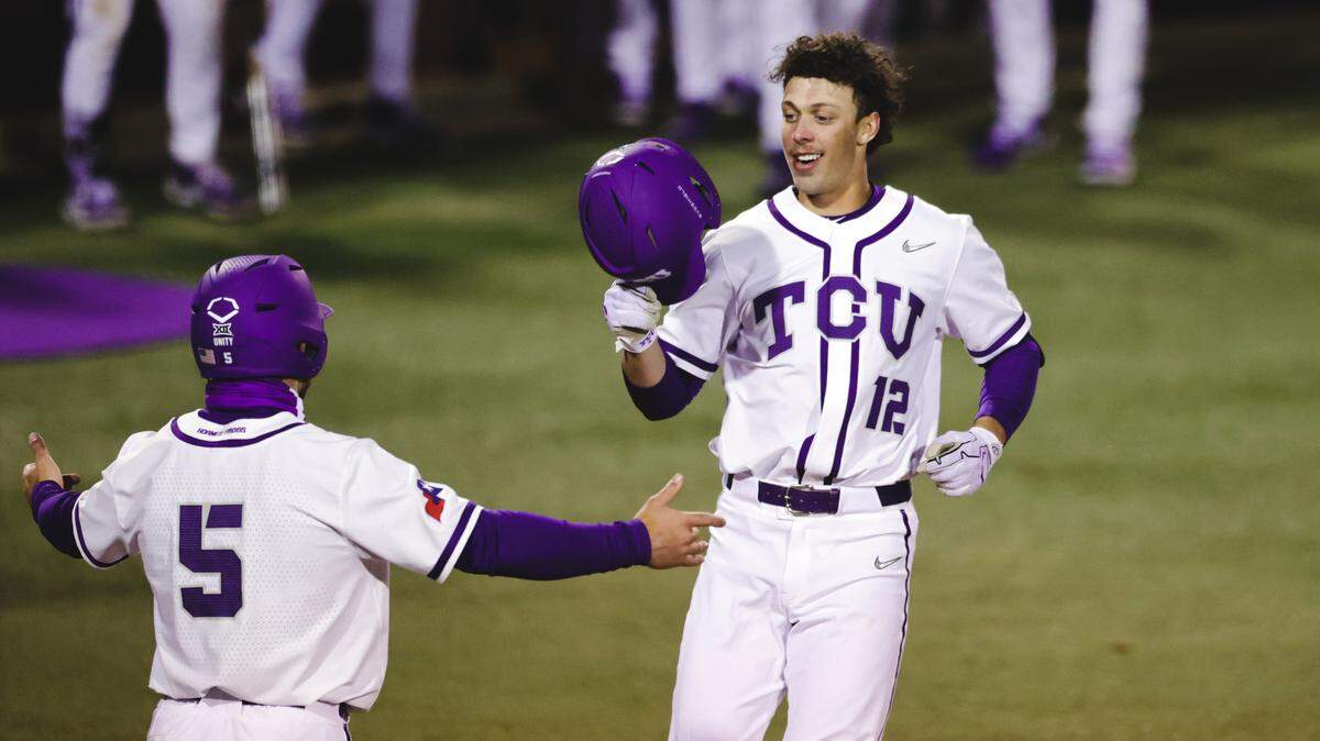 TCU’s David Bishop (12) celebrates his first college home run on Tuesday night.