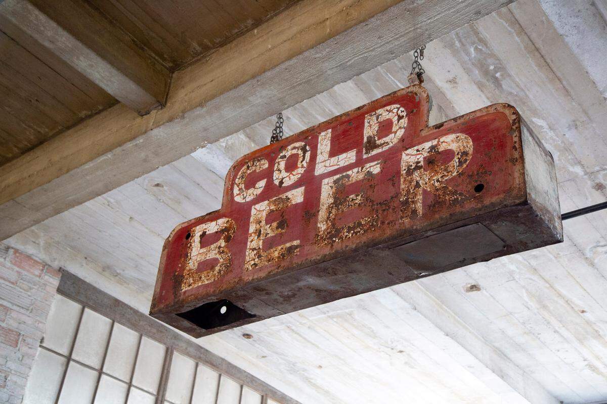 An old-time bar sign hangs in Provender Hall.