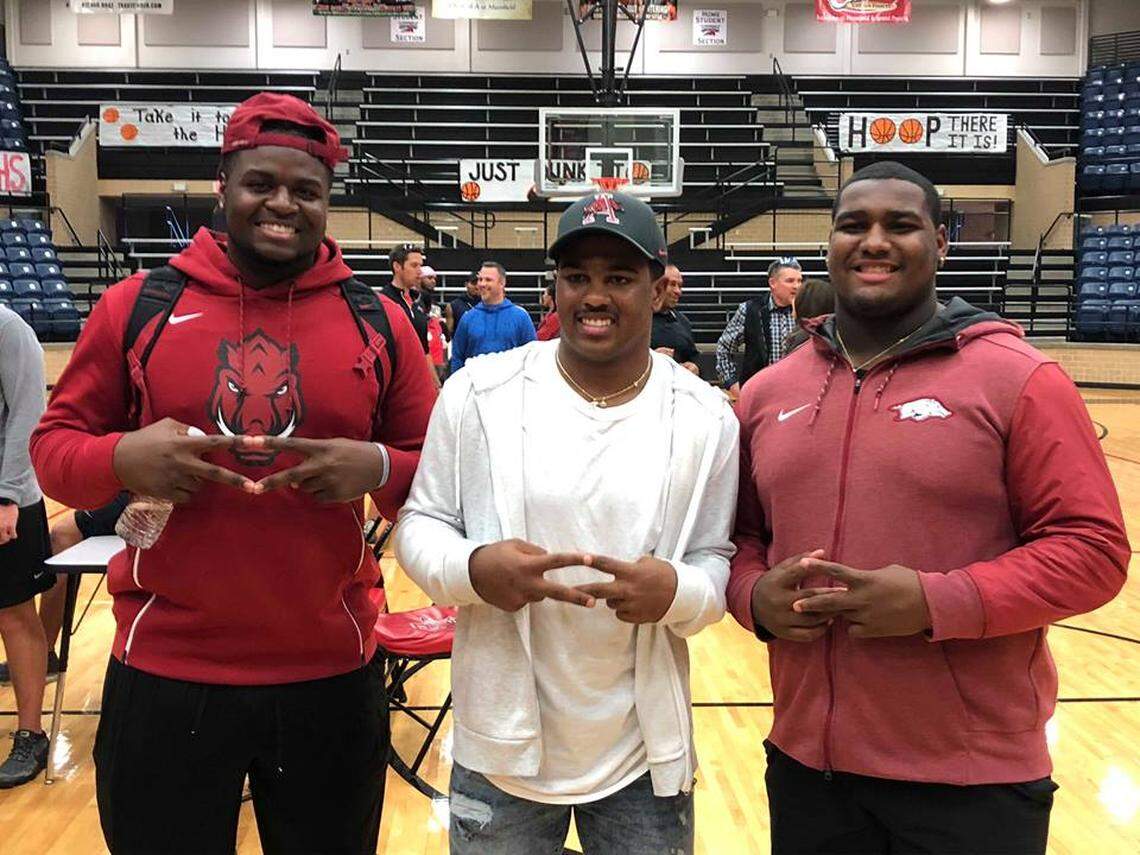 Legacy safety Jalen Catalon, middle, commits to Arkansas, Friday Jan. 18, 2019 where he’ll join teammates Taurean Carter and Enoch Jackson.