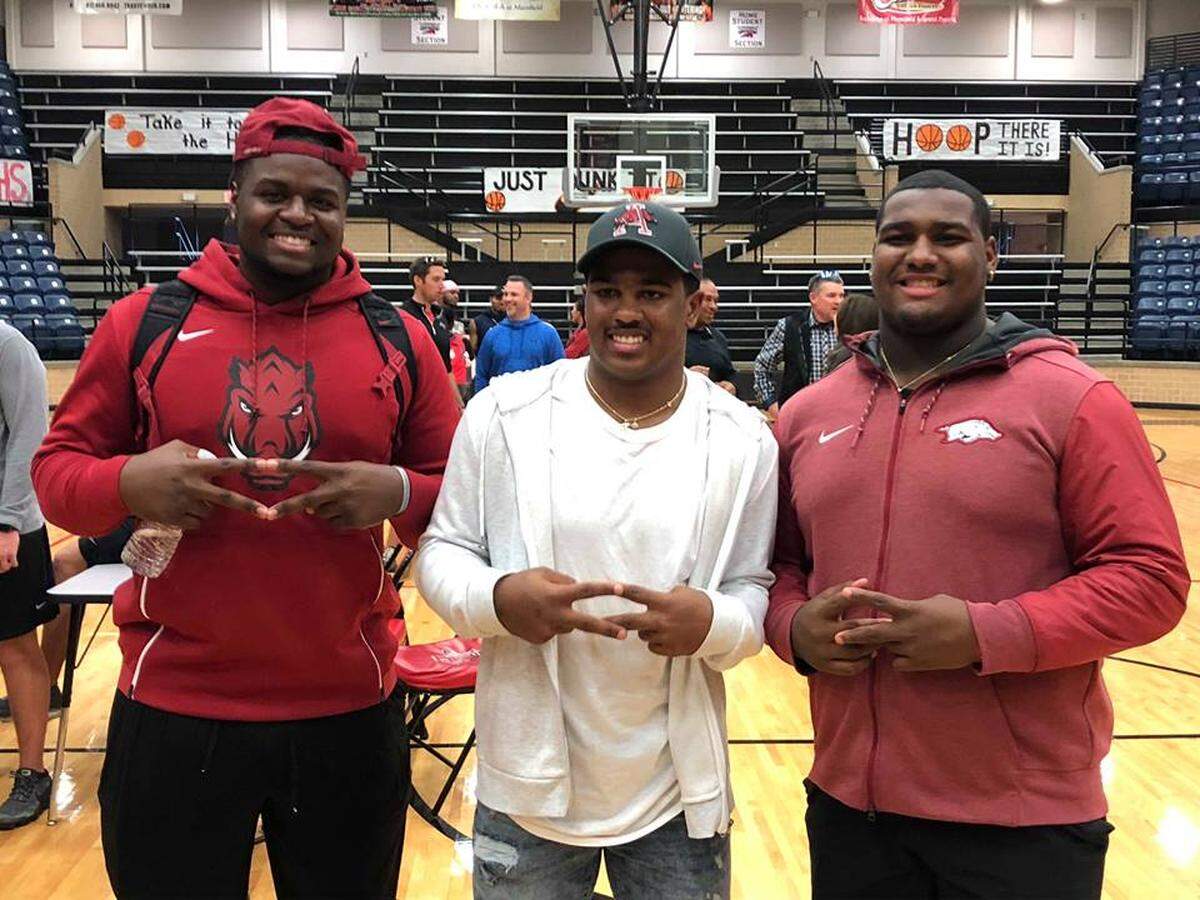 Legacy safety Jalen Catalon, middle, commits to Arkansas, Friday Jan. 18, 2019 where he’ll join teammates Taurean Carter and Enoch Jackson.