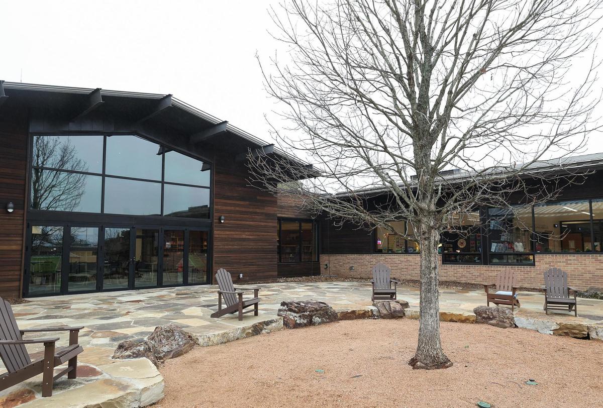 The new Annie Richardson Bass Lower School at Fort Worth Country Day features a flagstone patio space with a 25-foot Chinaquapin Oak at its center.