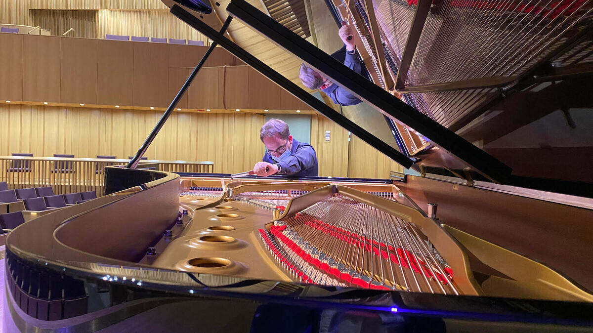 It normally takes Alex Moore an hour and a half to tune a piano.