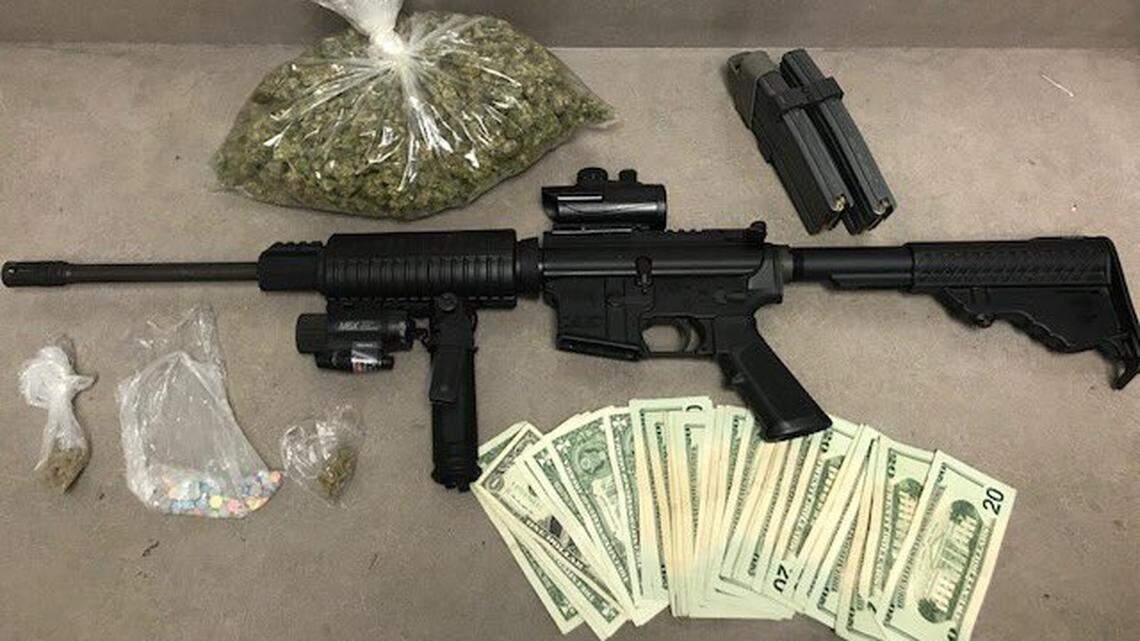 Arlington police say they seized this AR-15 gun, along with drugs and cash, from an intoxicated driver Thursday night.