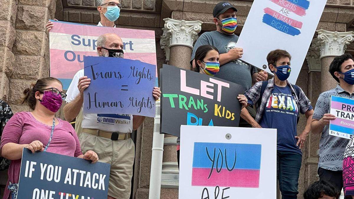 LGBTQ advocates protest transgender-related legislation in this 2021 file photo.