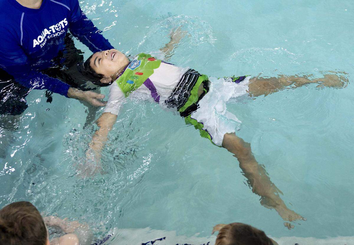 Samuel Ortega, 4, practices “chicken, star and rocket” which teaches students how to backstroke at Aqua-Tots Swim School on Thursday, May 21, 2026 in Fort Worth, Texas. Aqua-Tots hopes to teach students safety as well as confidence in the water.