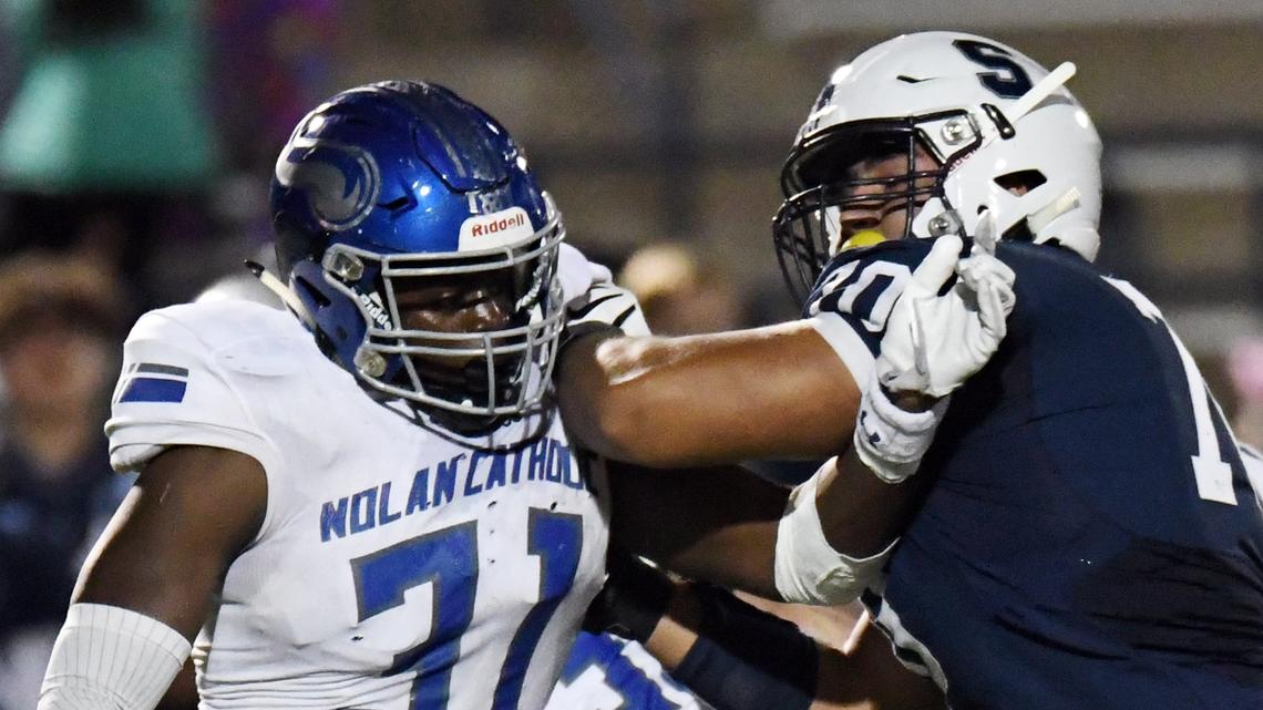 Nolan Catholic’s defensive end Nana Osafo-Mensah, left against All Saints during the first Half of Friday’s November 2, 2018 football game at McNair Stadium in Fort Worth, Texas. Special/Bob Haynes