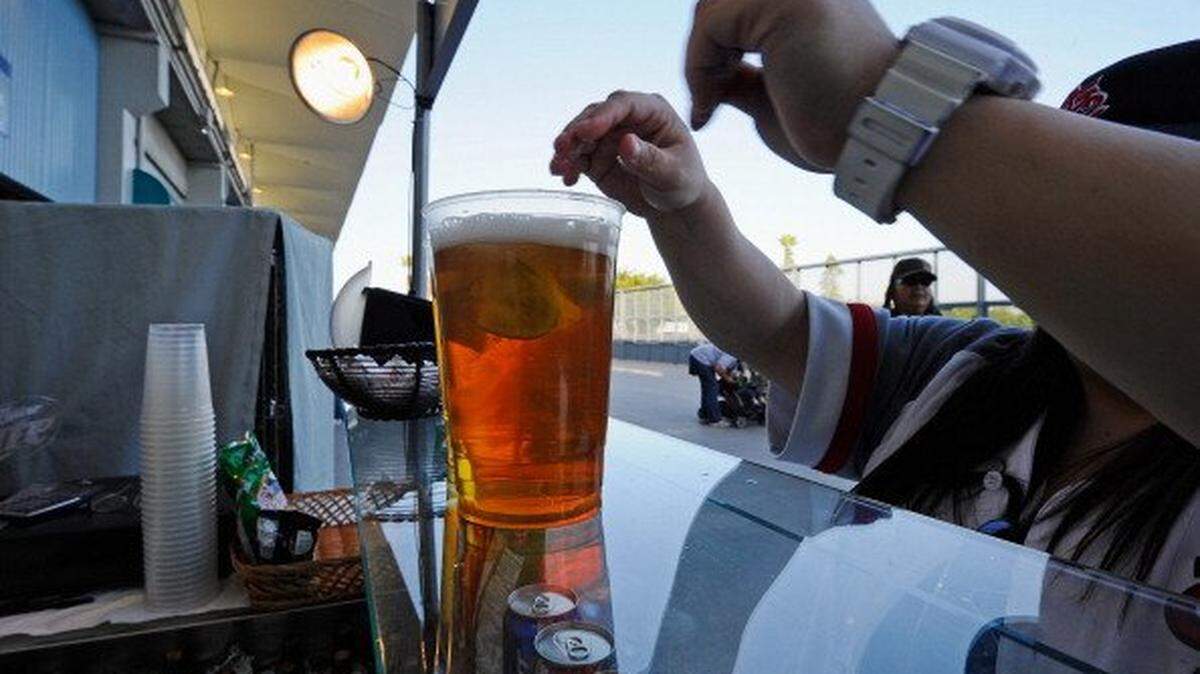 LOS ANGELES, CA - APRIL 14: A St. Louis Cardinal fan purchases beer at Dodger Stadium prior to the start of the baseball game between the St. Louis Cardinals and Los Angeles Dodgers on April 14, 2011 in Los Angeles, California. Large numbers of LAPD officers are being deployed as part of a zero tolerance policy toward misbehaving fans in response to the opening day attack on San Francisco Giants fan Bryan Stow two weeks ago. (Photo by Kevork Djansezian/Getty Images)