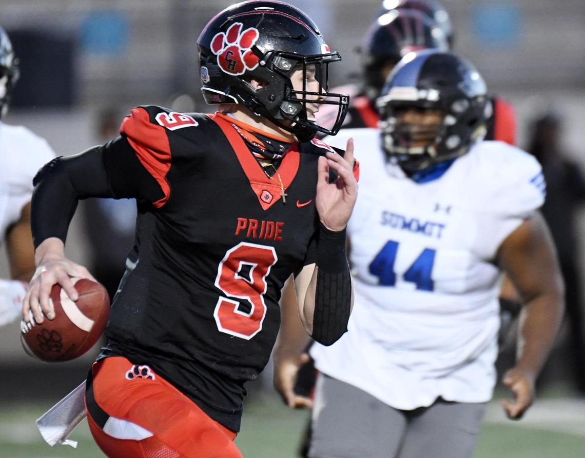 Colleyville Heritage quartrback AJ Smith- Shawver, left, scrambles away from Mansfield Summit’s Karon Thomas in the fourth quarter of their Division 1-5A Regional Round Play-off football game Saturday, December 26, 2020 at Bearcat Stadium in Aledo, Texas. Special/Bob Haynes