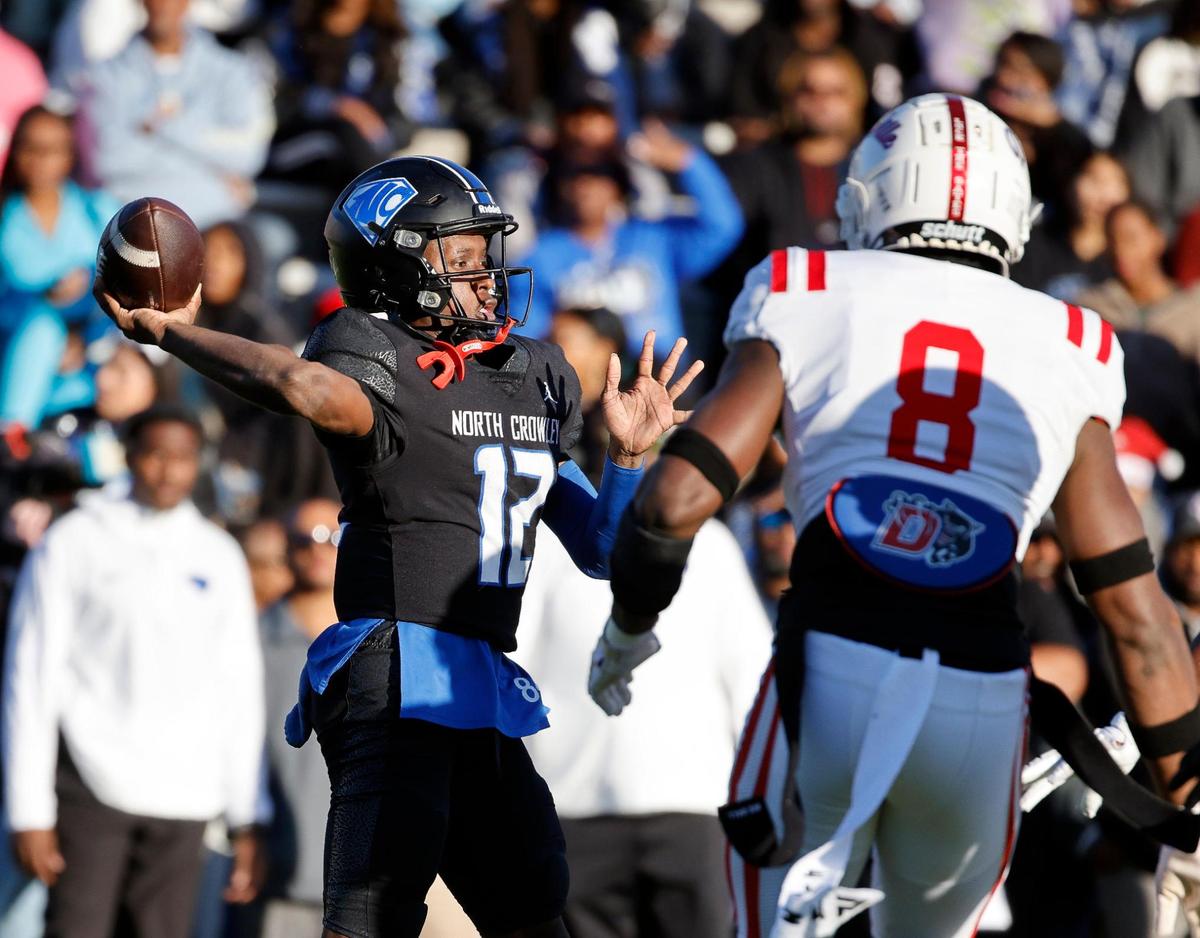 North Crowley quarterback Chris Jimerson (12) tosses an interception during the first half of a UIL Conference 6A Division I state semifinal football playoff game at Mesquite Memorial Stadium in Mesquite, Texas, Saturday, Dec. 09, 2023. Duncanville led North Crowley 24-0 at the half.