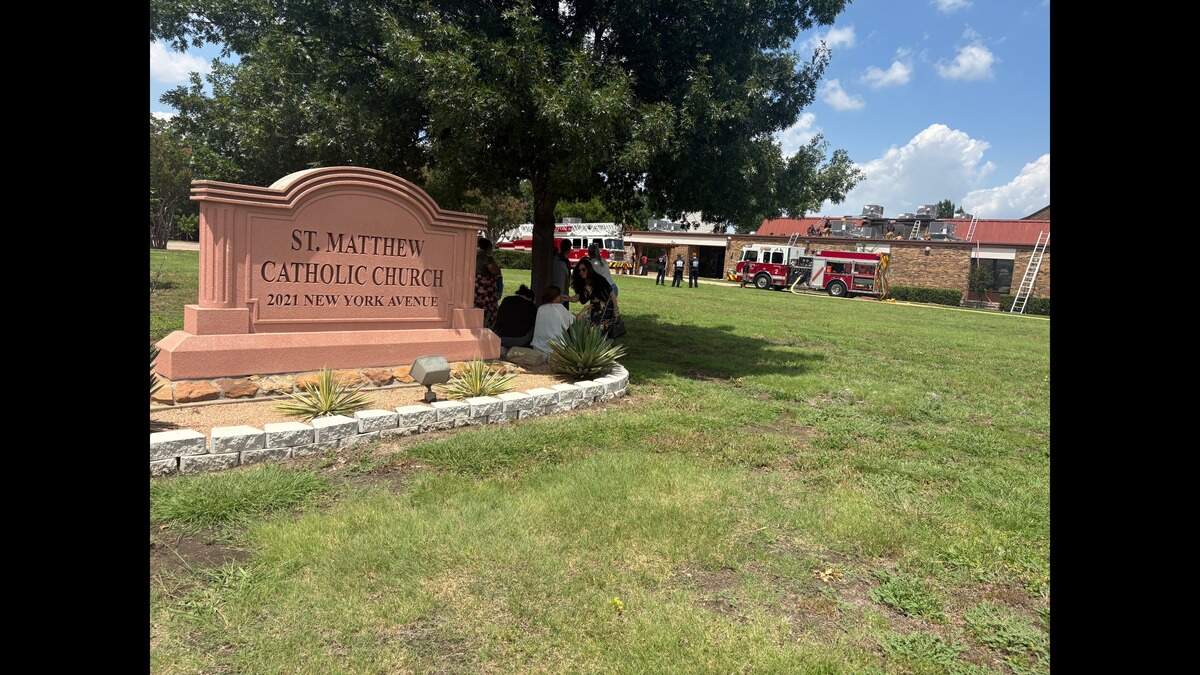 Arlington fire crews work to put out a fire on the roof of St. Matthew Catholic Church on Tuesday, June 16, 2026.